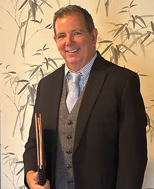 John Schaal officiating a joyful outdoor wedding ceremony in the Wilmington, Delaware area.