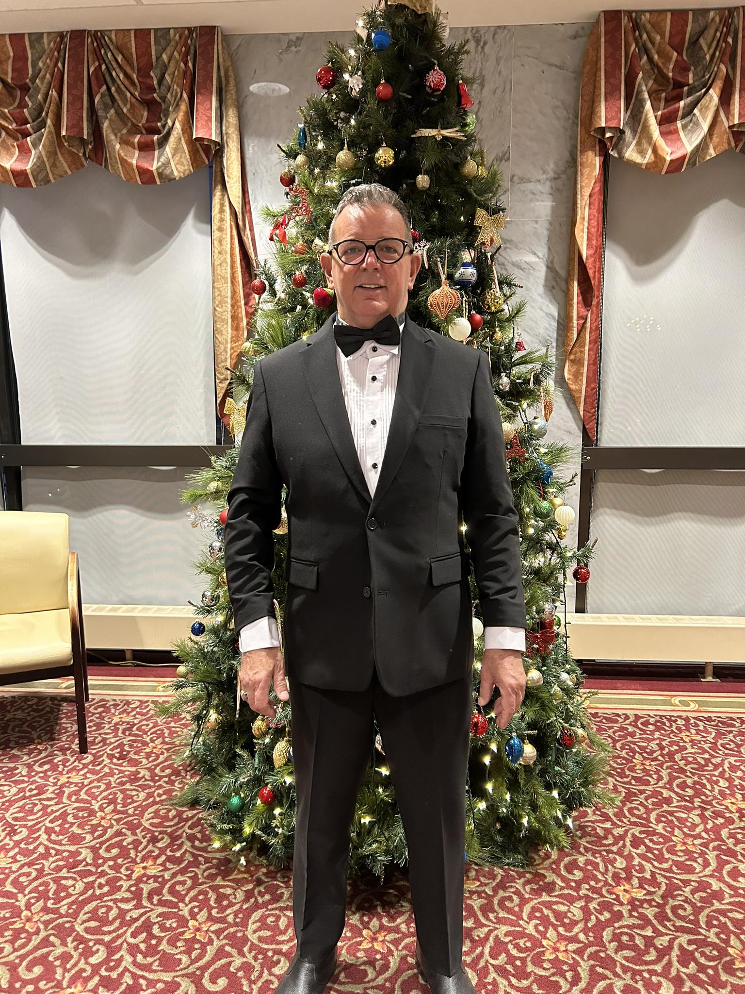 A friendly headshot of John Schaal, wedding officiant.